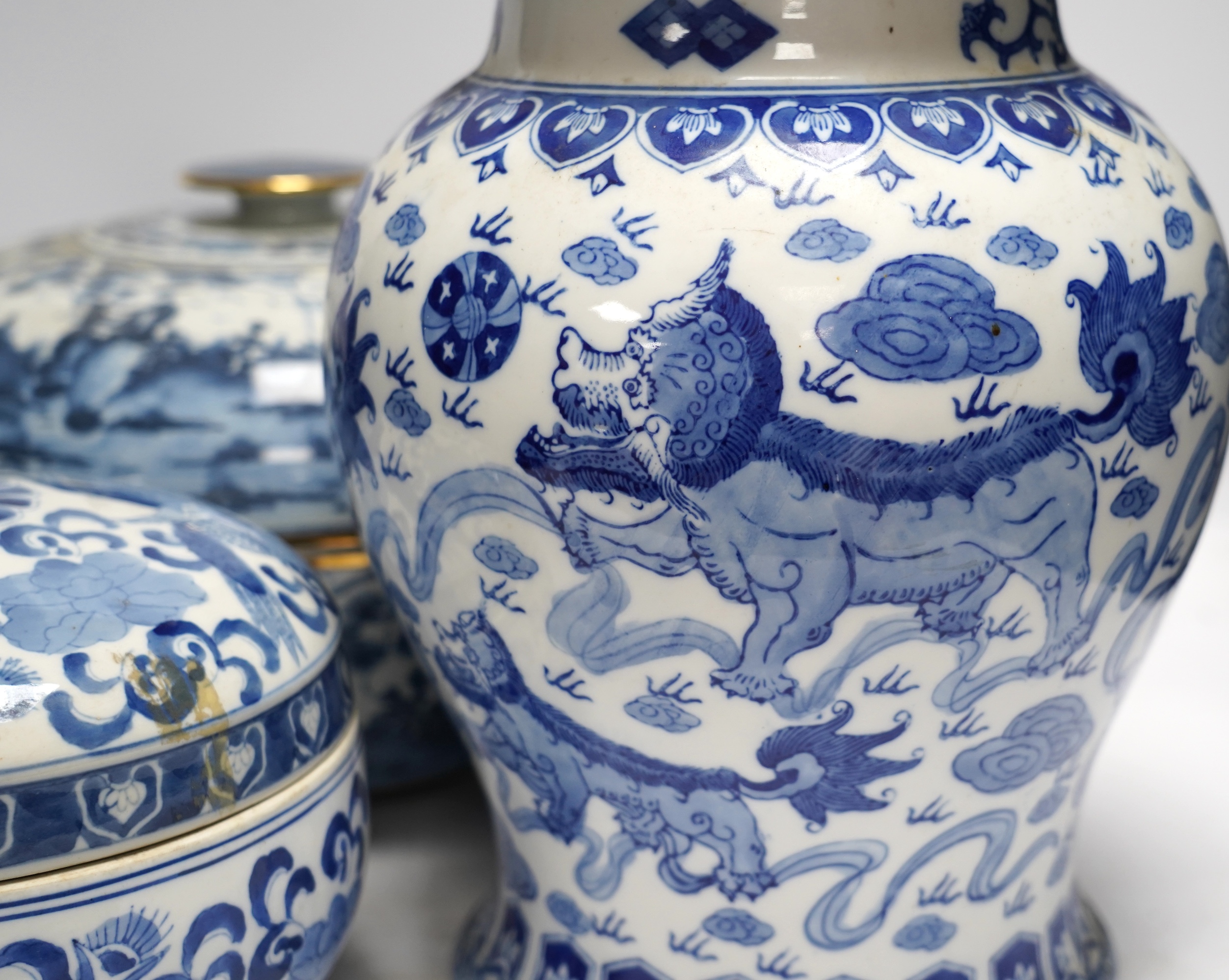 A 20th century Chinese blue and white vase and cover, a large bowl and cover and a smaller bowl and cover, tallest 44cm
